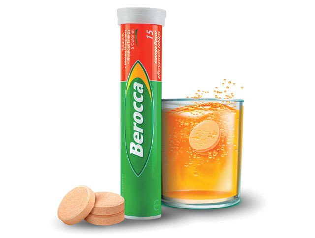 Tube of Berocca Performance Effervescent Tablets Orange Flavor 15 - Vitamin B, C, Calcium, Magnesium & Zinc showing one dissolving effervescent tablet in a glass of water.